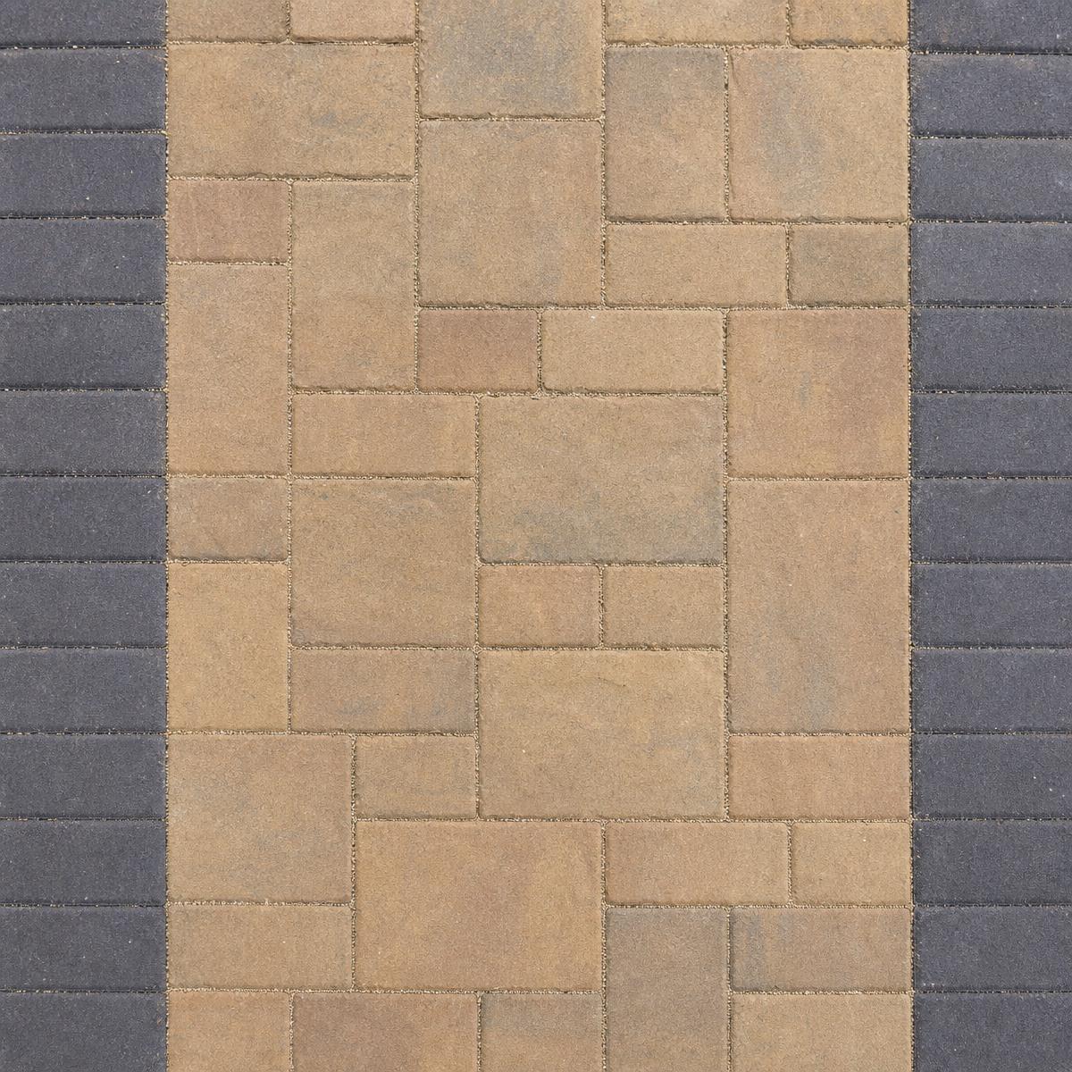 Ribbon driveway with ground cover between paver strips